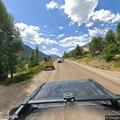 Car with flat tire in dangerous spot on Ophir Road