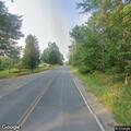 Report of grass blown into roadway in Swanville
