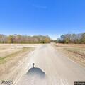 Roadside brush fire near light pole on County Road 515