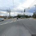 Traffic lights flashing red at busy intersection