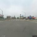 Person with dog seen looking over highway bridge