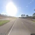 Pickup hauling car on trailer with no tail light