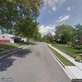 Overturned vehicle in front of Haverhill School
