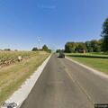 Person on bicycle in roadway near Windsor Road