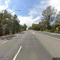 Woman screaming at cars near roadway in Soulsbyville