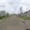 Partially open storm drain creating road hazard