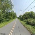 Man having panic attack in black Ford Explorer on road