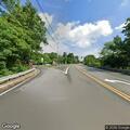 Tree branch at risk of falling into roadway