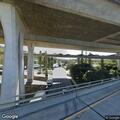 Abandoned vehicle on freeway right shoulder