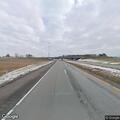 Concern for person kneeling near highway exit