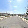 Man standing in middle of residential street