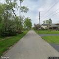 Small wood pile fire near residence in Titusville