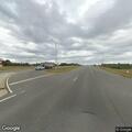 Dog running in lanes on Highway 2 near Wilton