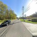 Unoccupied vehicles blocking roadway on Grand Avenue