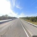 Speeding vehicle with sparking tire on turnpike