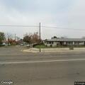 Male pedestrian sitting on curb near McKinley Avenue