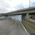 Person enters hole under bridge on Portland Avenue