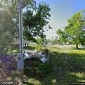 Man walking in roadway near East 122nd Street