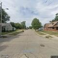Person wrapped in blanket found near tree at Pine and Laurel