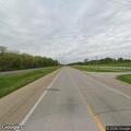 Person with head injuries and breathing issues by roadside
