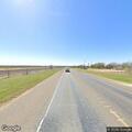 Smoke in open field near railroad tracks on TX 174