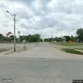 Woman in wheelchair having active seizure at intersection