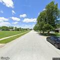 Person walking repeatedly on residential street