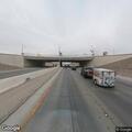 Cyclist riding on freeway shoulder near St. Rose