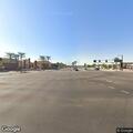 Person experiencing chest pain at roadway intersection