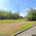 Man found lying on ground with dog and beer bottles nearby