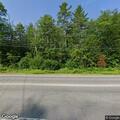 Tree partially blocking highway near Tufts Lane