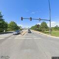 Person standing motionless on road at Old Turnpike and Manchester