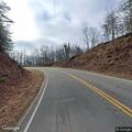 Large rock blocking roadway on Mineral Springs