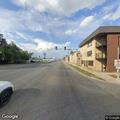 Female holding chest in intersection at Harlem Ave and 41st St