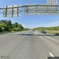 Driver hits detour sign and continues on highway