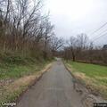 Tree blocking road with possible power lines