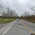 Vehicle overturns in ditch with person trapped inside