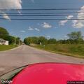 Disabled car partially blocking roadway