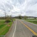 White pickup truck stopped on highway 676