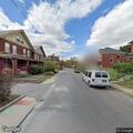 Man breaking into parked vehicle on Madison Ave