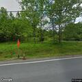 Unsecured utility wires with trees in Mountain Dale