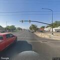 Grass fire near building on Washington Boulevard