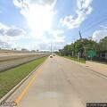 Officer assists stalled SUV on highway shoulder