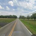 Utility pole hanging by wires on Paris Avenue