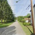 Truck pulls down wires and cracks telephone pole