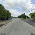 Person experiencing chest pain on South Maple Street