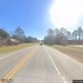 Elderly woman incoherent walking along GA highway