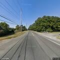 Tree limb hanging over roadway on Sound Avenue