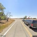 Single tree smoking near Highway 141 and Road 25