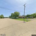 Vehicle partially blocking roadway on Main Street